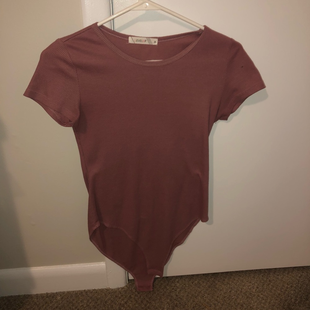 tight fitting, pink body suit